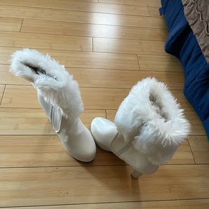White boots with a gold decal